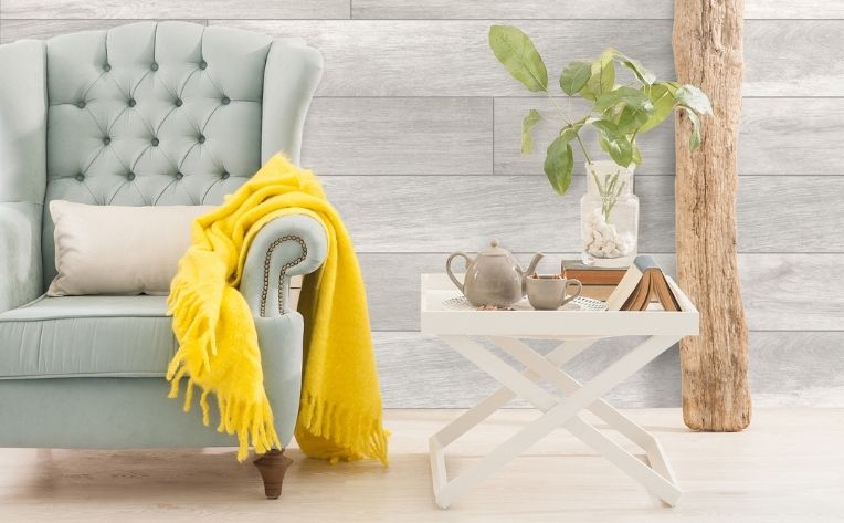 blue accent chair with bright and natural decor